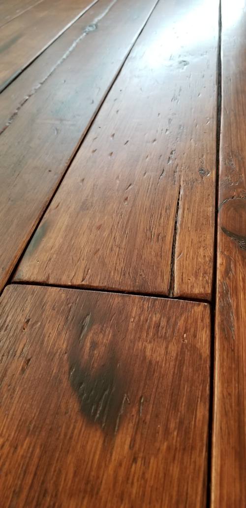 DIY Rustic Wide Plank Plywood Flooring - Close up pictures Of The Distressed, burned and stained plywood floors