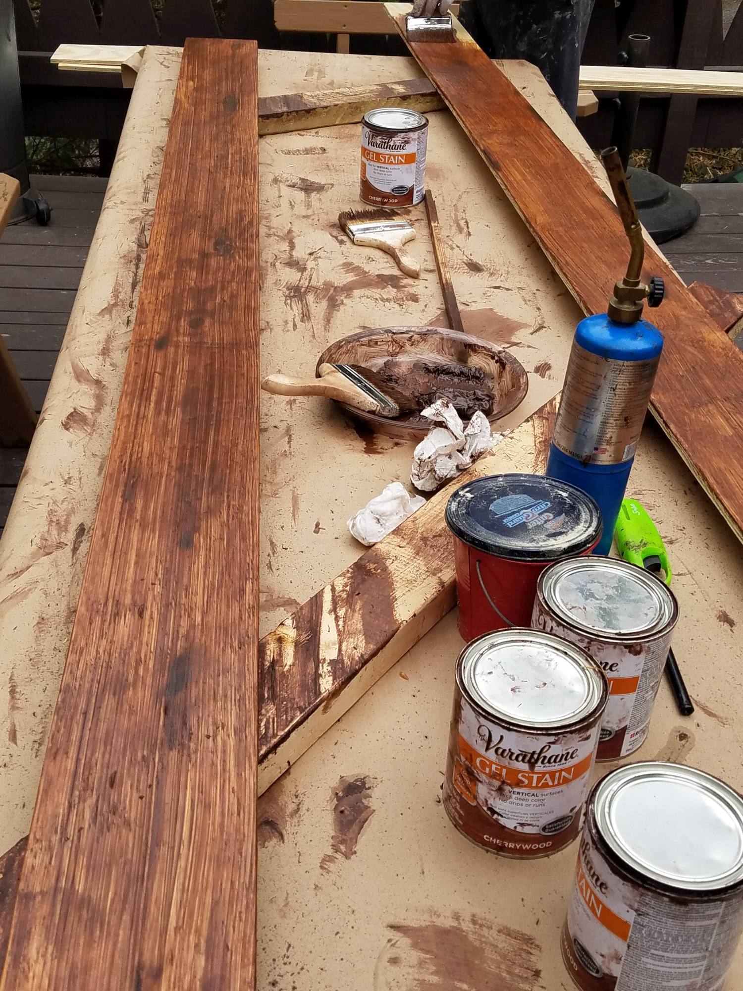DIY Farmhouse Wide Plank Flooring Made From Plywood - Applying Gel Stain and distressing to the wide plank plywood floor boards